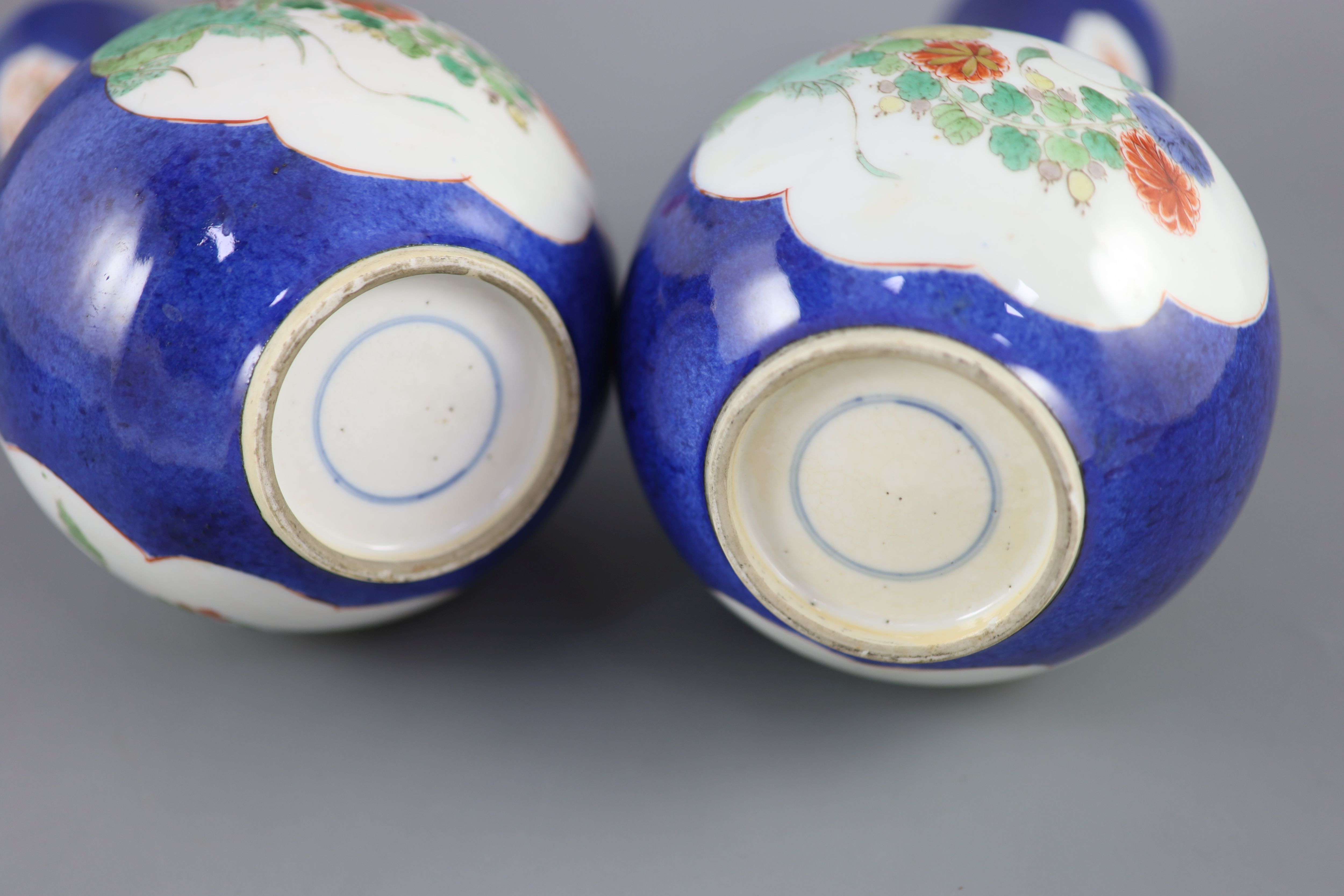 A pair of Chinese powder blue famille verte bottle vases, Kangxi period (1662-1722), 26cm high